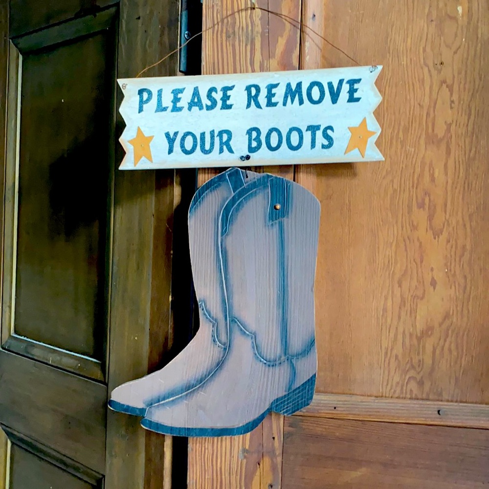 Hanging wall cowboy boots wooden sign.